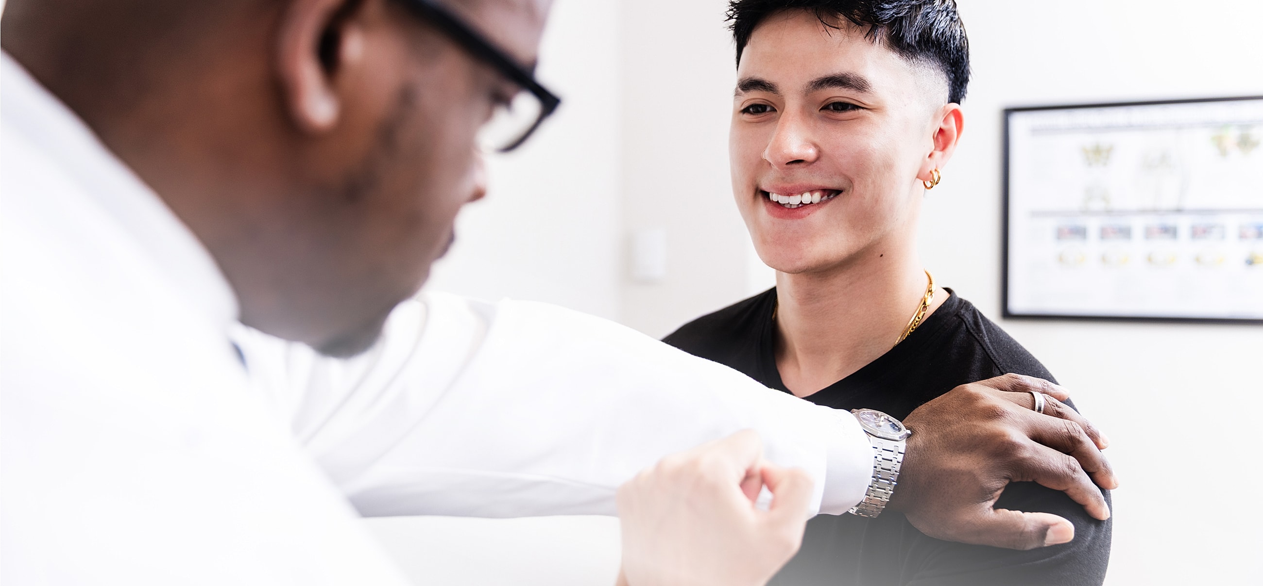 Disc replacement surgery patient model interacting with a spine surgeon during a consultation.