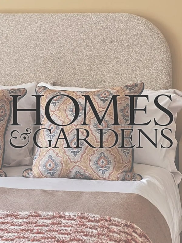 Decorative pillows on a stylish bed setting.