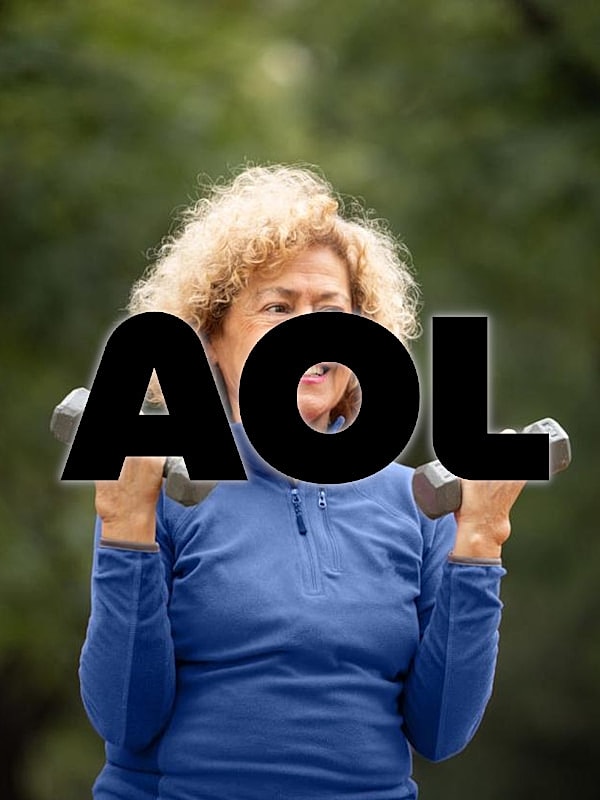 Senior woman lifting weights outdoors.