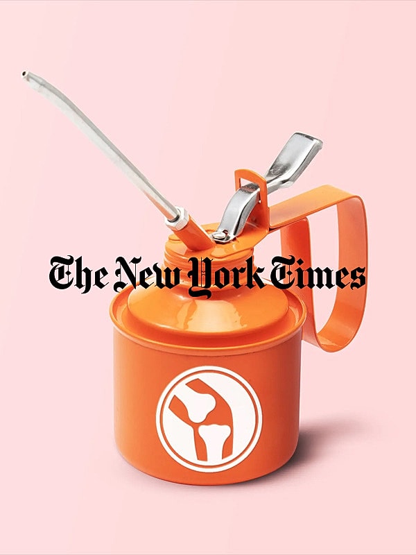 Orange oil can with spout and handle.