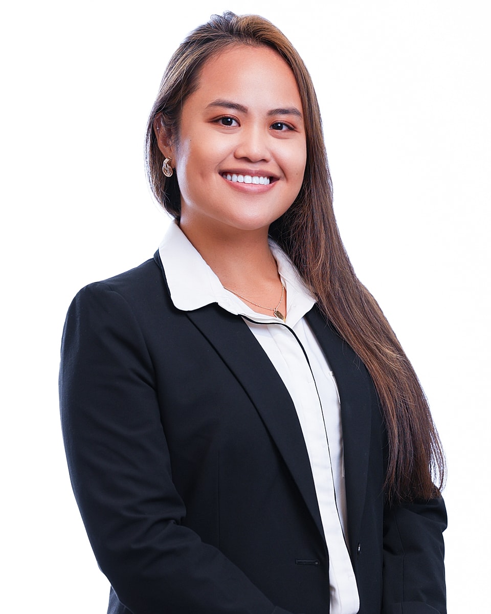 Professional woman smiling in a business suit.