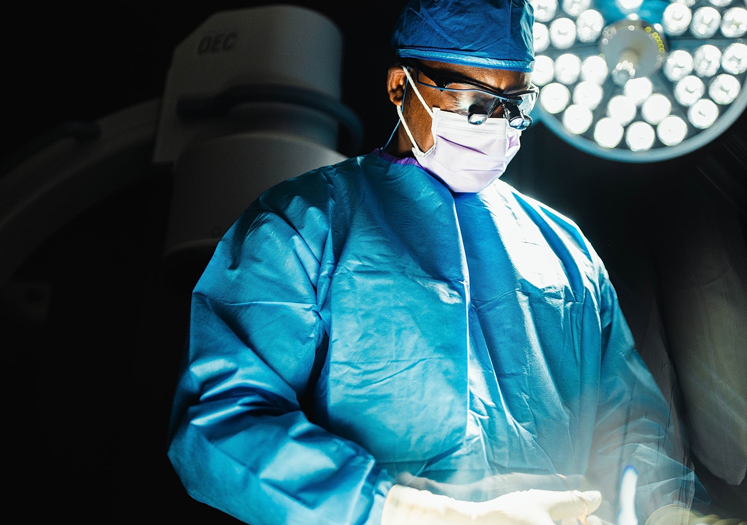 spine surgeon in scrubs preparing for surgery.