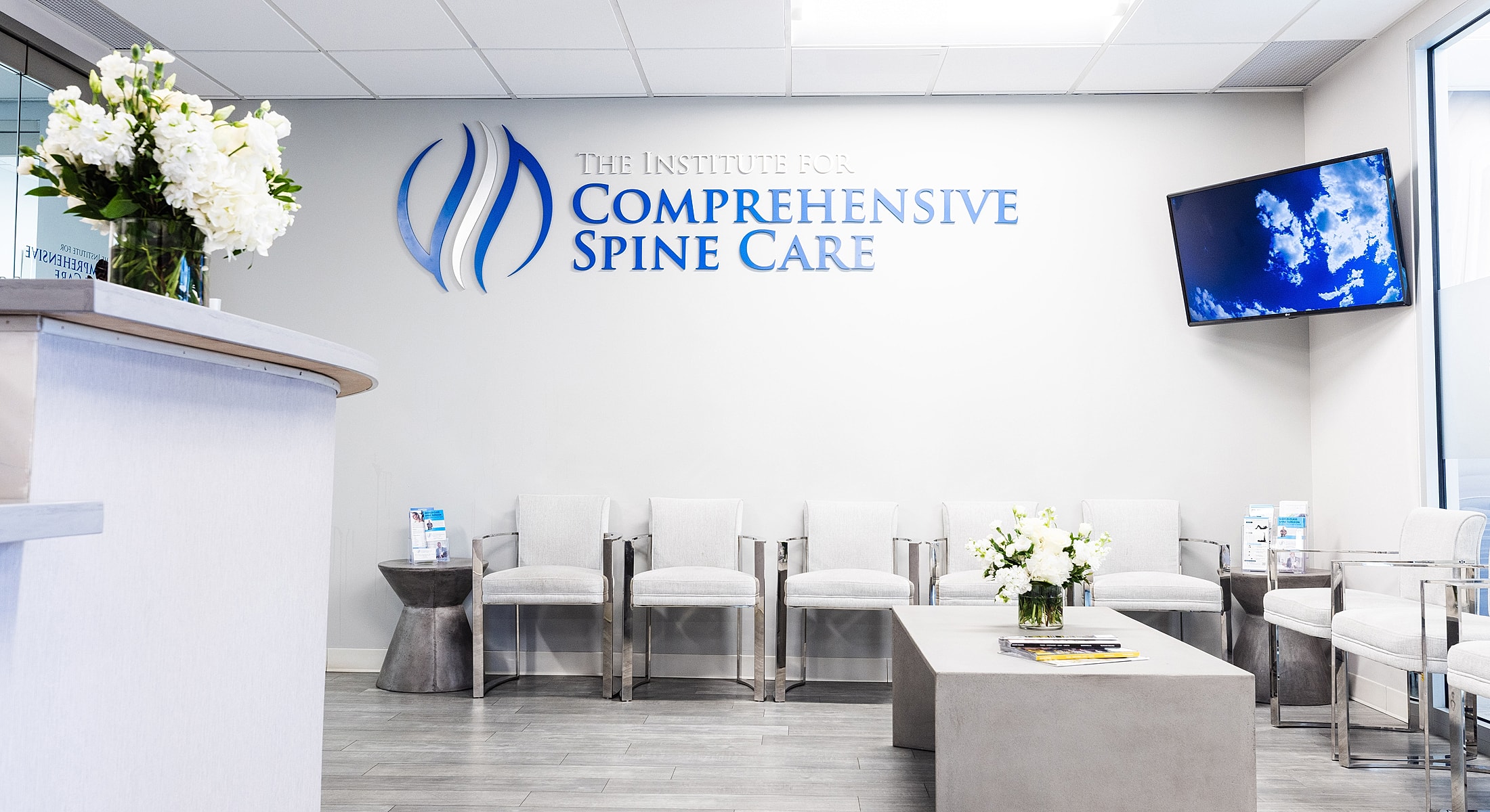 Modern spine care office interior with seating.